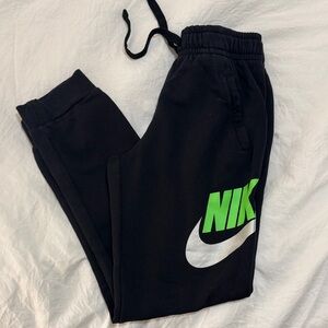 Nike Kids Black Joggers with Green and Silver Logo